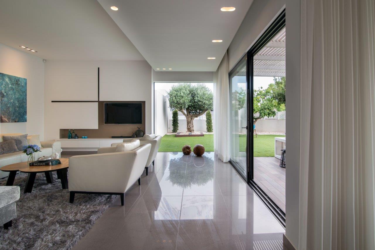 The olive tree at the end of the central axis, seen from the entrance towards the living room