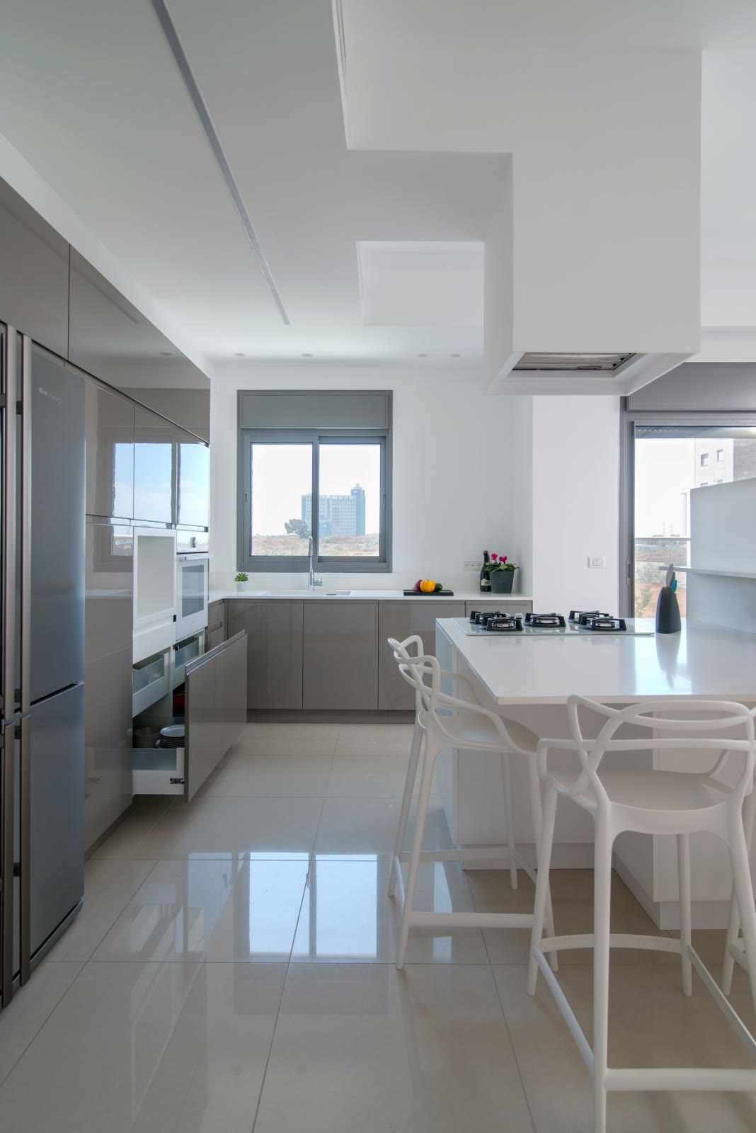 A utensil drawer pulled open — storage the full width of the unit beneath the worktop
